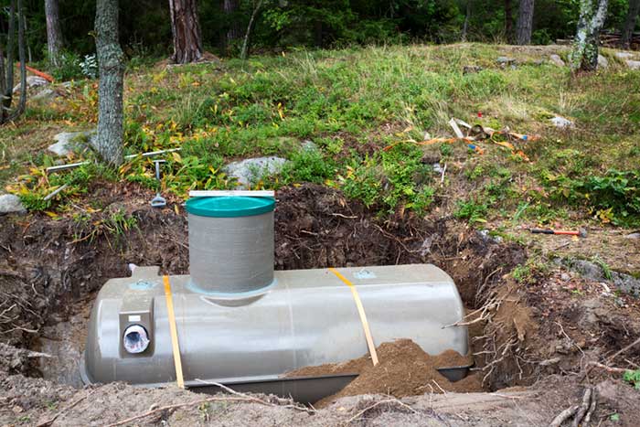 Septic tank in a hole in the ground.